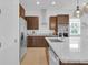 Kitchen featuring stainless steel appliances, modern cabinetry, and stone countertops at 10120 Sunnifa Aly, Orlando, FL 32832