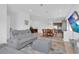 Spacious living room featuring modern furniture, recessed lighting, and an open concept kitchen at 10120 Sunnifa Aly, Orlando, FL 32832