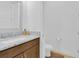 Powder room with modern vanity, granite counters, bronze fixtures, and a toilet at 10120 Sunnifa Aly, Orlando, FL 32832