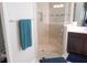 Modern bathroom featuring a glass-enclosed shower with sleek fixtures at 14146 Jomatt Loop, Winter Garden, FL 34787