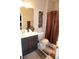 Bathroom view featuring a modern vanity, toilet, and decorative accessories at 14146 Jomatt Loop, Winter Garden, FL 34787