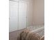 Bedroom featuring carpet and a mirrored closet at 14146 Jomatt Loop, Winter Garden, FL 34787