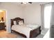 Bedroom featuring neutral walls, wood flooring, and a comfortable bed at 14146 Jomatt Loop, Winter Garden, FL 34787