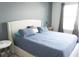 Comfortable bedroom with a large bed and natural light at 14146 Jomatt Loop, Winter Garden, FL 34787