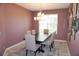 Elegant dining room with contemporary chandelier and seating for six at 14146 Jomatt Loop, Winter Garden, FL 34787