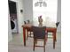 Bright dining room features modern lighting, a large window, and updated flooring at 14146 Jomatt Loop, Winter Garden, FL 34787