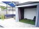 An outdoor space with a golf simulator and comfortable seating perfect for enjoying a game or relaxing at 14146 Jomatt Loop, Winter Garden, FL 34787