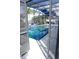Sparkling pool and spa area with clear blue water, visible through a screen door at 14146 Jomatt Loop, Winter Garden, FL 34787