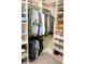 Organized walk-in closet with custom shelving and ample storage space at 14146 Jomatt Loop, Winter Garden, FL 34787