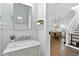 Stylish bathroom featuring a marble vanity, modern fixtures, and natural light flowing in from the window at 16262 Firedragon Dr, Winter Garden, FL 34787