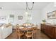 Bright dining area with hardwood floors, round table, and natural light at 16262 Firedragon Dr, Winter Garden, FL 34787