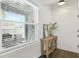Cozy entryway features a window to the outdoor patio, and a wooden table at 16262 Firedragon Dr, Winter Garden, FL 34787