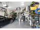 Spacious garage with overhead storage, shelving, and room for vehicles and equipment at 16262 Firedragon Dr, Winter Garden, FL 34787