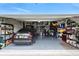 Well-organized garage with storage shelving, ample space, and a parked car at 16262 Firedragon Dr, Winter Garden, FL 34787