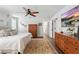 Spacious Primary bedroom with ceiling fan, hardwood floors, and walk-in closet at 16262 Firedragon Dr, Winter Garden, FL 34787
