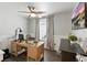 Bright office features a ceiling fan, natural light, and workspace for productivity at 16262 Firedragon Dr, Winter Garden, FL 34787