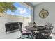 Private outdoor patio features a grill, dining set, and tasteful decor at 16262 Firedragon Dr, Winter Garden, FL 34787