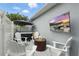 Outdoor patio space featuring a hot tub, fireplace, and TV for relaxation and entertainment at 16262 Firedragon Dr, Winter Garden, FL 34787