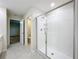 Modern Primary bathroom with sleek glass shower, tile flooring, and access to the toilet room at 16436 Fernridge St, Clermont, FL 34714
