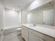 Bright bathroom featuring a white quartz countertop and tiled shower and flooring at 16436 Fernridge St, Clermont, FL 34714