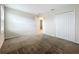 Bedroom with double door closet, plush carpeting and a window for natural light at 16436 Fernridge St, Clermont, FL 34714