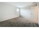 Empty bedroom featuring plush carpeting, a window, and a bright interior at 16436 Fernridge St, Clermont, FL 34714
