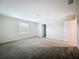 Well-lit carpeted bedroom with neutral walls and a window offers a tranquil, relaxing space at 16436 Fernridge St, Clermont, FL 34714