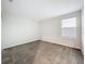 Neutral bedroom with a window for natural light and plush carpeting at 16436 Fernridge St, Clermont, FL 34714