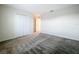 This room boasts a large closet, plush carpet, and neutral paint at 16436 Fernridge St, Clermont, FL 34714
