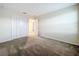 Comfortable bedroom featuring plush carpeting and an open door, showcasing its inviting atmosphere at 16436 Fernridge St, Clermont, FL 34714