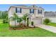 Charming two-story home with landscaped yard, beautiful lawn and a two car garage at 16436 Fernridge St, Clermont, FL 34714
