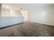 A spacious carpeted loft area is versatile, providing an open transition to the second floor at 16436 Fernridge St, Clermont, FL 34714