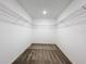 Walk-in closet providing ample storage with wire shelving and carpeted floor at 16436 Fernridge St, Clermont, FL 34714
