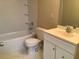 Bathroom with tile shower, white vanity, and tile floors at 200 W Doane Ave, Eustis, FL 32726