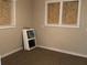 Bedroom with boarded up windows and a carpeted floor at 200 W Doane Ave, Eustis, FL 32726