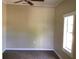 Bedroom featuring carpeted floors, base trim and a ceiling fan at 200 W Doane Ave, Eustis, FL 32726