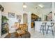 Cozy dining room with seating for four and access to the kitchen at 214 Paloma Dr, Davenport, FL 33837