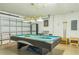 Well lit game room includes a pool table and an air hockey table at 214 Paloma Dr, Davenport, FL 33837