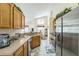 Modern kitchen featuring a stainless steel refrigerator and plenty of natural light at 214 Paloma Dr, Davenport, FL 33837