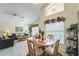Open concept living room and dining area filled with natural light at 214 Paloma Dr, Davenport, FL 33837
