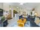 Bright and airy living room with tile floors, comfortable seating, and an open layout at 214 Paloma Dr, Davenport, FL 33837