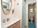 Bathroom featuring modern vanity and glass shower door at 2430 Westwood Dr, Longwood, FL 32779