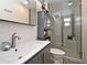 Updated bathroom featuring glass shower door and modern vanity at 2430 Westwood Dr, Longwood, FL 32779