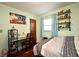 Bedroom with green walls, hardwood floors and desk at 2430 Westwood Dr, Longwood, FL 32779