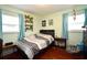 Bright bedroom with hardwood floors and two windows at 2430 Westwood Dr, Longwood, FL 32779
