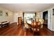 Dining room has hardwood floors, a dining table, natural light, and is an elegant setting for meals and gatherings at 2430 Westwood Dr, Longwood, FL 32779