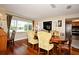 Dining room features hardwood floors, backyard views, a dining table and is conveniently located next to the kitchen at 2430 Westwood Dr, Longwood, FL 32779