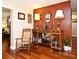 Living room showcasing hardwood floors, accent wall, and custom shelving, creating an inviting atmosphere at 2430 Westwood Dr, Longwood, FL 32779