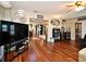 Bright living area featuring beautiful wood floors and stylish lighting at 2430 Westwood Dr, Longwood, FL 32779