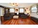 Spacious living room with hardwood floors, a comfortable sectional sofa, and ample natural light at 2430 Westwood Dr, Longwood, FL 32779